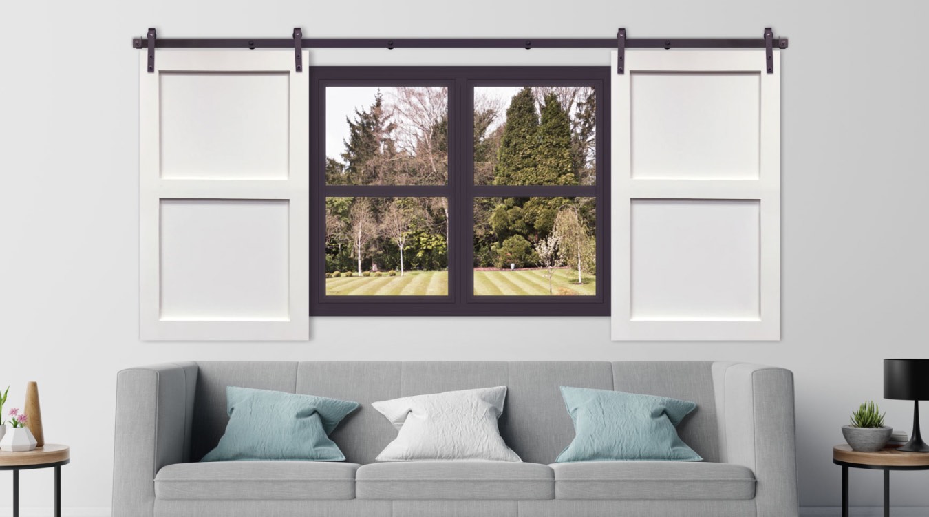 White barn door shutter in streamlined Raleigh living room